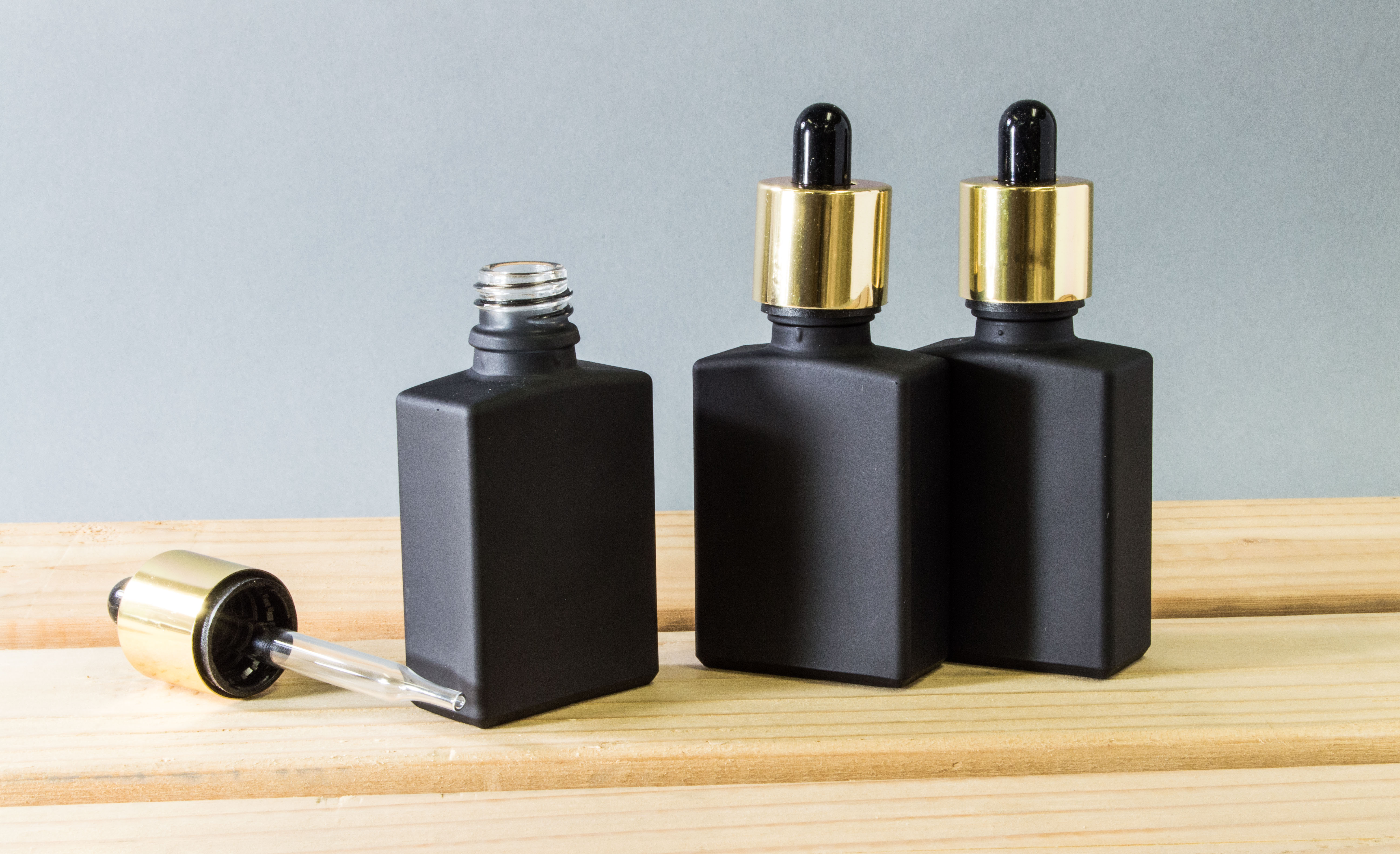 Download 30ml Black Glass Rectangle Dropper Bottle with Gold Plated ... Yellowimages Mockups