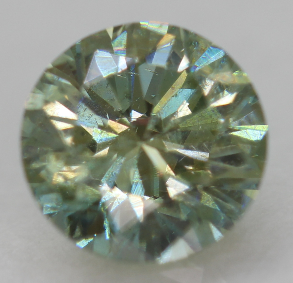 Cert 0.54 Carat Vivid Green VS1 Round Brilliant Natural Enhanced Diamond 5.19mm